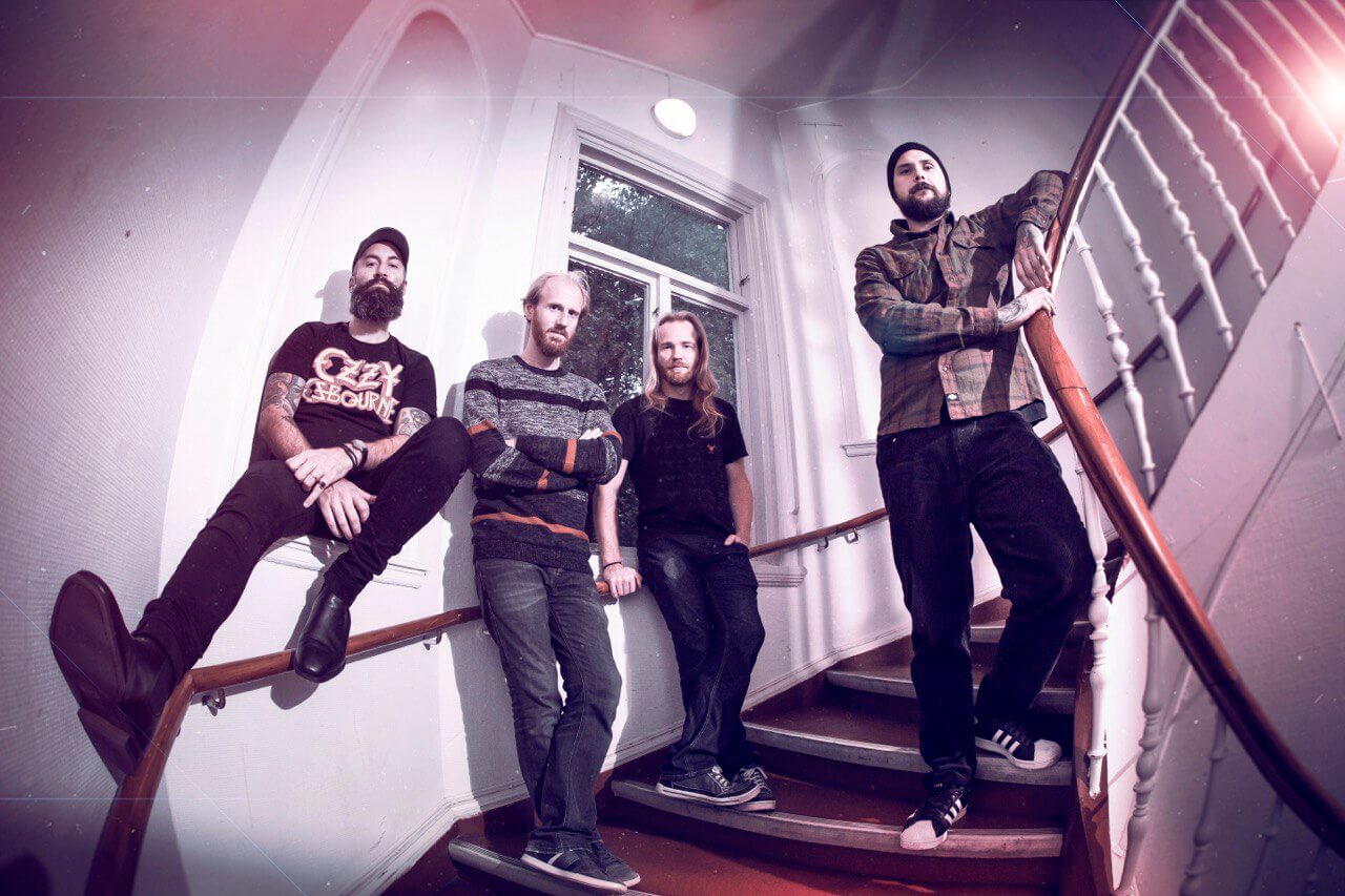 Descarado, the four band members